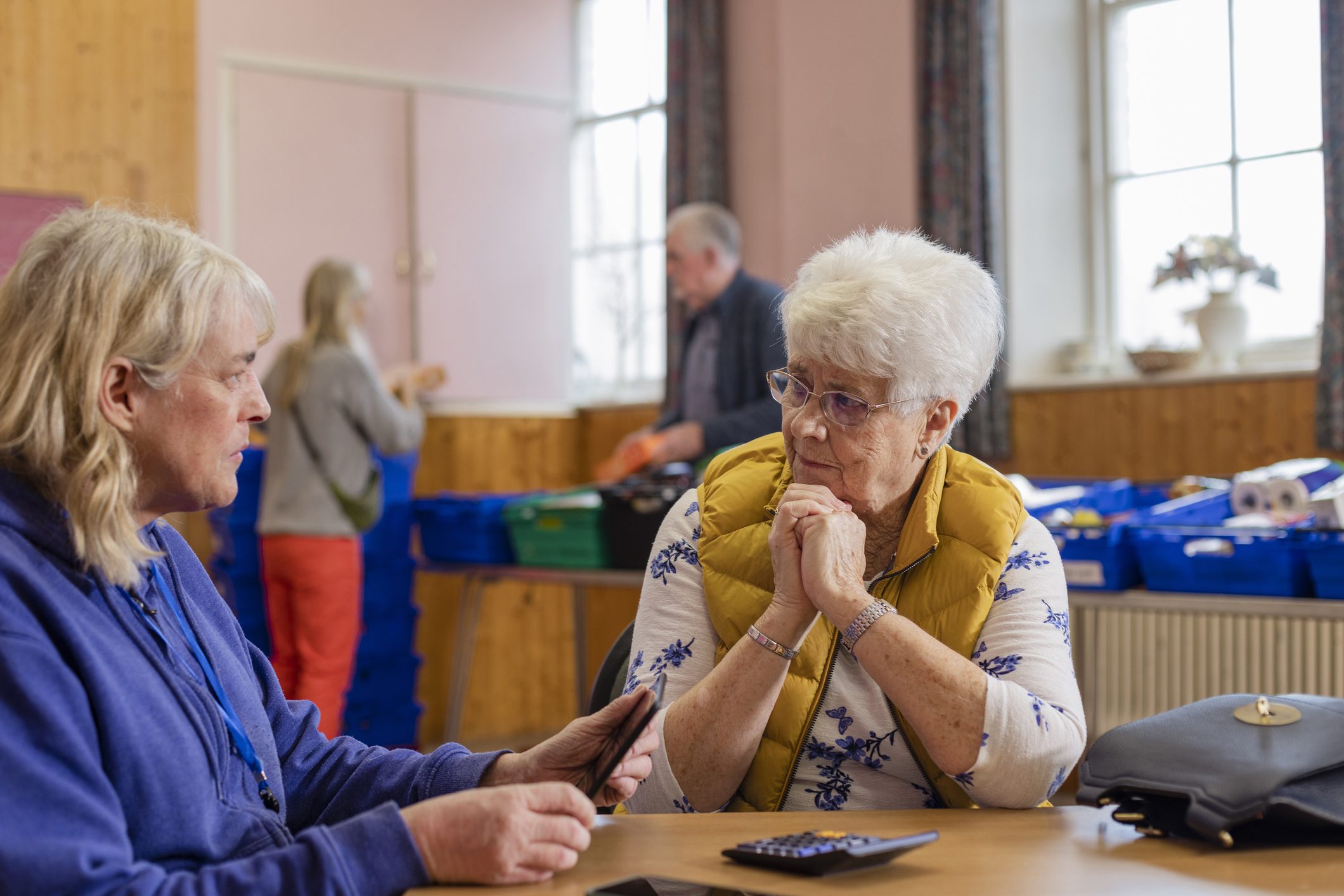 Women talking at community center table